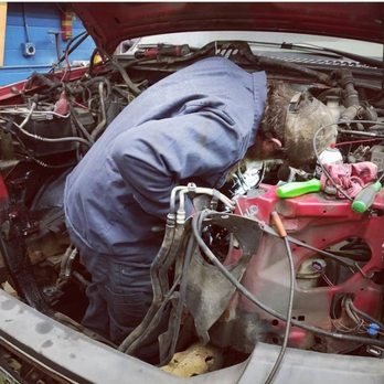 Mike's Garage - Mike working on a diesel motor. - Auto Repair Near Me - Woodsville, New Hampshire Mike's Garage - Mike working on a diesel motor. - Auto Repair Near Me - Woodsville, New Hampshire