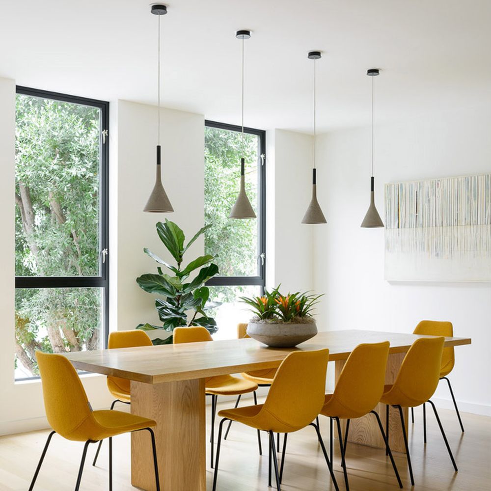 Design Line Construction - a modern dining room with yellow chairs - General Contractors Near Me - San Francisco, California Design Line Construction - a modern dining room with yellow chairs - General Contractors Near Me - San Francisco, California