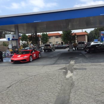 Chevron - a red sports car at a gas station - Gas Stations Near Me - Los Angeles, California