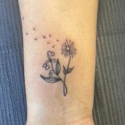 Dandelion and lilies of the valley tattoo. Dandelion and lilies of the valley tattoo.