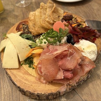 Storehouse Market & Eatery - Incredible chess plate with added prosciutto. So many added little spreads and flavors. - Cocktail Bars Near Me - Bastrop, Texas