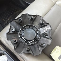 Broken cap that was on the rim fine before I had the jeep worked on. Now broken Broken cap that was on the rim fine before I had the jeep worked on. Now broken