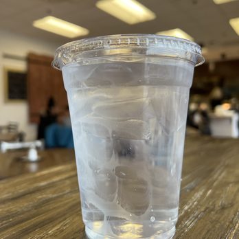 KitchenCray Cafe - a clear plastic cup on a wooden table - Breakfast & Brunch Near Me - Lanham, Maryland