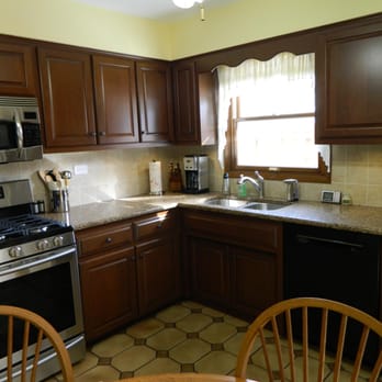 Steinhour Construction - Cherry cabinets / Granite counters / tiled back splash - Cabinetry Near Me