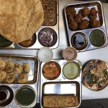 Vik's Chaat - top left to top right- Chole bhatura and vegetable pakoras Bottom left to bottom right- pani puri, chicken kathi roll, and dahi papri chaat - Indian Near Me - Berkeley, California Vik's Chaat - top left to top right- Chole bhatura and vegetable pakoras Bottom left to bottom right- pani puri, chicken kathi roll, and dahi papri chaat - Indian Near Me - Berkeley, California
