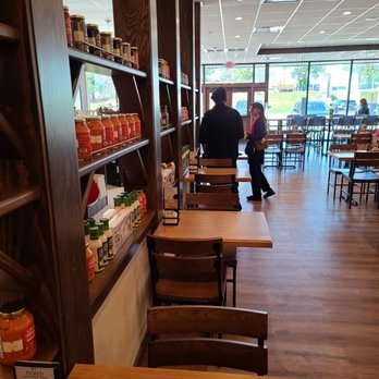 la Madeleine - the inside of a restaurant with tables and chairs - Bakeries Near Me - Conroe, Texas