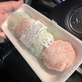 Saigon Market - a person holding a plastic container of donuts - Grocery Near Me - Portland, Oregon Saigon Market - a person holding a plastic container of donuts - Grocery Near Me - Portland, Oregon