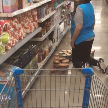 Walmart Supercenter - Cluttering an aisle stocking candles. - Department Stores Near Me - Covina, California