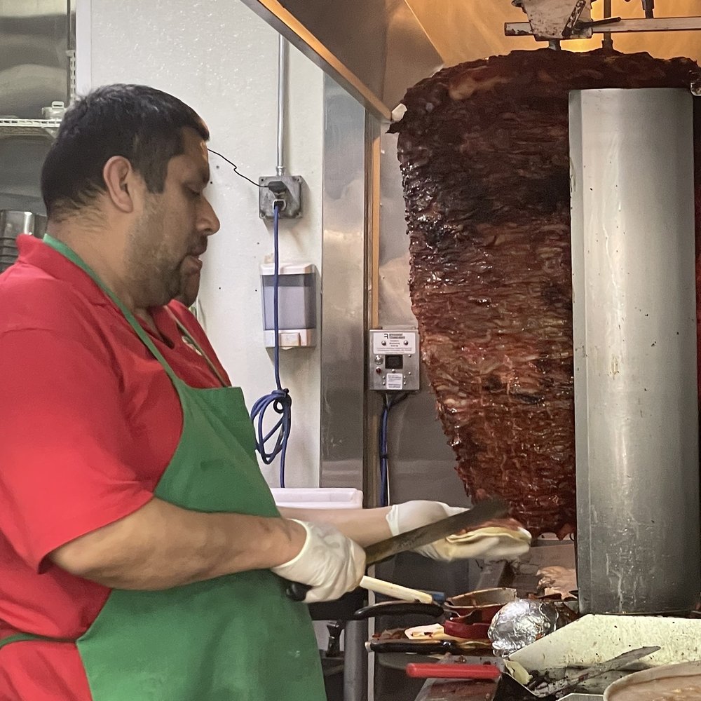 Huge Trompo meat cooking..... just for comparison, this guy is about 6'3 Huge Trompo meat cooking..... just for comparison, this guy is about 6'3