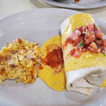 The Toasted Yolk Cafe - Breakfast burrito with hashbrown casserole - Breakfast & Brunch Near Me - Fleming Island, Florida