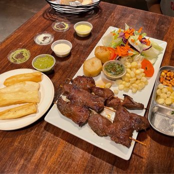Rosty - Anticuchos & Yucca Frita (also delicious extra dipping sauces) - Peruvian Near Me - Los Angeles, California Rosty - Anticuchos & Yucca Frita (also delicious extra dipping sauces) - Peruvian Near Me - Los Angeles, California