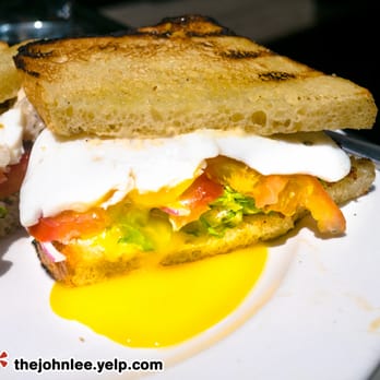Parish Cafe & Bar - Egg Sandwich Lyonnaise - Two eggs fried over-easy and served on toasted white bread with applewood smoked bacon, tomato, sliced red onion - Sandwiches Near Me - Boston, Massachusetts Parish Cafe & Bar - Egg Sandwich Lyonnaise - Two eggs fried over-easy and served on toasted white bread with applewood smoked bacon, tomato, sliced red onion - Sandwiches Near Me - Boston, Massachusetts