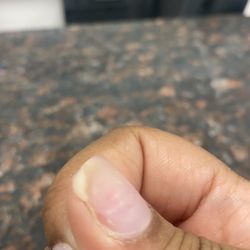 L & L's Nail Salon - Uneven acrylic , not fully covering my natural nail