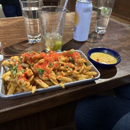 Hot fries with side of cheese sauce. Hot fries with side of cheese sauce.