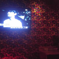 K-Mix Karaoke & Bar - TV and song selection system in a small private room.