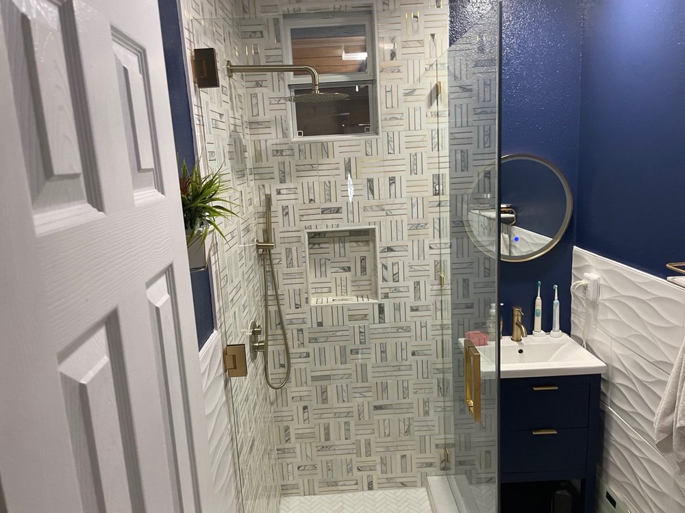 Glass shower walls with brushed nickel handle. Yelp