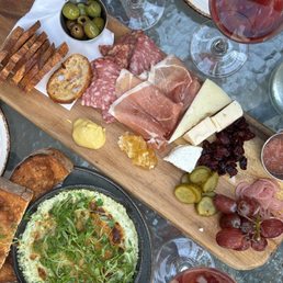 Meat and cheese charcuterie board and artichoke dip Meat and cheese charcuterie board and artichoke dip