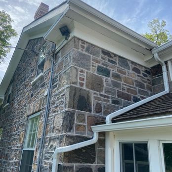 Eavestrough Cleaning Specialists - White eavestrough and downspouts installed - Roofing Near Me - Toronto, Ontario