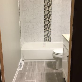 Pro Handz Renovation - a bathroom with a shower, toilet, and bathtub - General Contractors Near Me Pro Handz Renovation - a bathroom with a shower, toilet, and bathtub - General Contractors Near Me