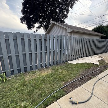 Alex Star Service - Painting the fence with a spray gun - Handyman Near Me