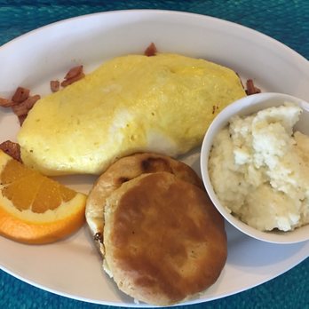 Banana River Cafe - Ham and cheese omelet - shaved ham and little cheese just ok.  Amazing homemade biscuit,  grits tasty. - Cafes Near Me - Satellite Beach, Florida