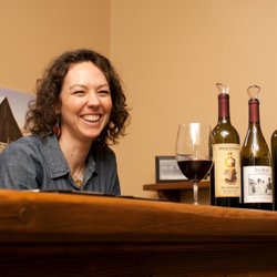 The Touring Company - Ali behind the bar at Dumas Station, her family's winery