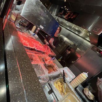 Cberrys Barbecue - a man preparing food in a kitchen - Barbeque Near Me - Lincoln, Nebraska Cberrys Barbecue - a man preparing food in a kitchen - Barbeque Near Me - Lincoln, Nebraska