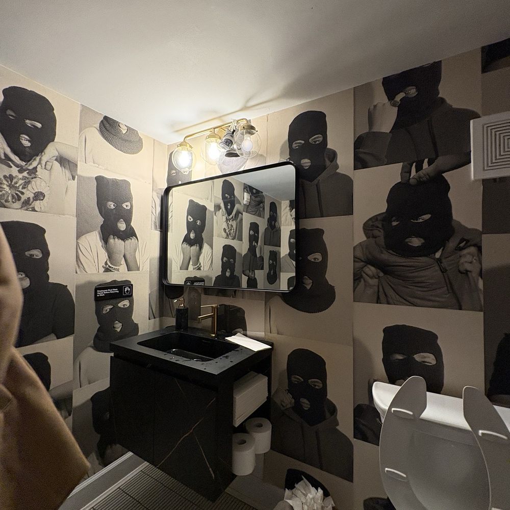 Young Buck Deli - Bathroom with robber wallpaper - Sandwiches Near Me - Cincinnati, Ohio Young Buck Deli - Bathroom with robber wallpaper - Sandwiches Near Me - Cincinnati, Ohio