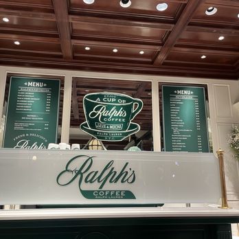 Ralph’s Coffee - Inside Ralph's Coffee, located within a Ralph Lauren store, featuring menu boards and a prominent Ralph's Coffee logo sign. - Coffee & Tea Near Me - Chicago, Illinois