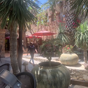 Caffe El Triunfo - View across the indoor patio... note the 2nd story arched windows with no upper story! - Pizza Near Me - El Triunfo, BCS