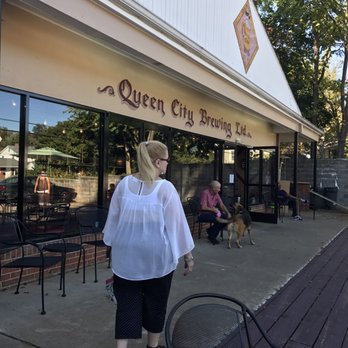 Queen City Brewing - a woman walking down the sidewalk - Breweries Near Me - Staunton, Virginia Queen City Brewing - a woman walking down the sidewalk - Breweries Near Me - Staunton, Virginia