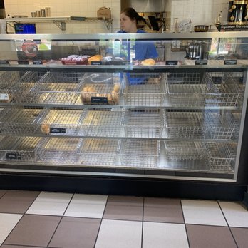 Manhattan Bagel - a woman in a bakery - Bagels Near Me - Williamsburg, Virginia Manhattan Bagel - a woman in a bakery - Bagels Near Me - Williamsburg, Virginia