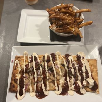 Outpost 611 Eatery & Taphouse - Pork belly Flatbread with a ranch drizzle and a mini poutine - American Near Me - Clearwater, Florida