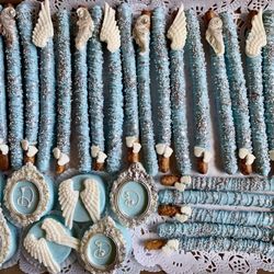 The Queen's Kitchen - Chocolate covered pretzel rods, chocolate covered Oreos in baby blue and silver with white accents