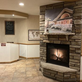 The Cottage - Entry fireplace - American Near Me - Traverse City, Michigan The Cottage - Entry fireplace - American Near Me - Traverse City, Michigan