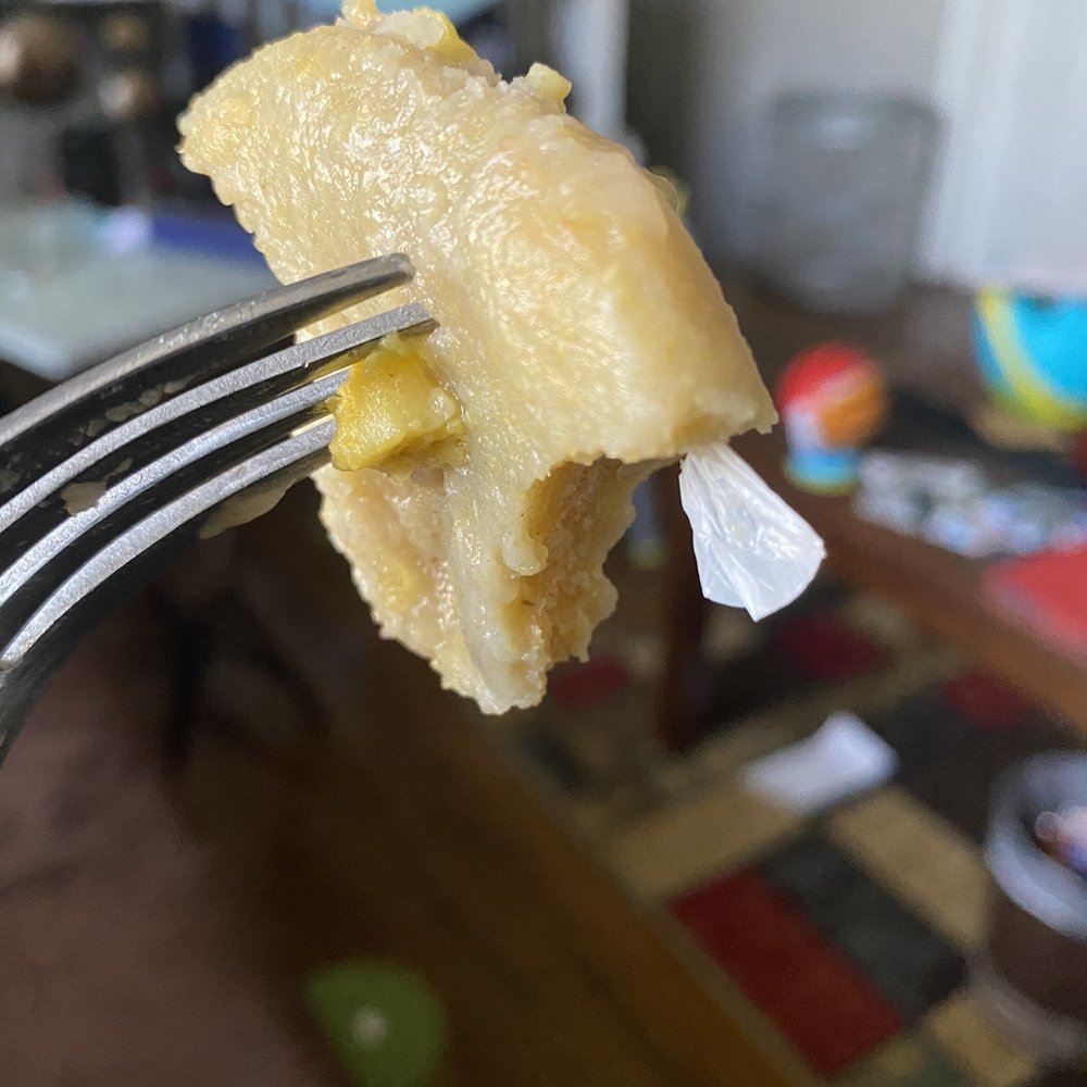 Top Taste - a piece of food on a fork - Caribbean Near Me - Irvington, New Jersey