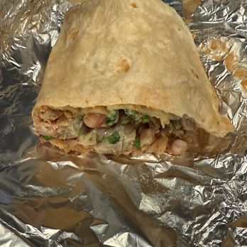 Tacos El Chilango - Half a carnitas burrito - Tacos Near Me - San Francisco, California Tacos El Chilango - Half a carnitas burrito - Tacos Near Me - San Francisco, California
