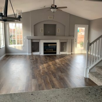 Morris Flooring - a living room with a fireplace and stairs - Carpeting Near Me - Brighton, Colorado Morris Flooring - a living room with a fireplace and stairs - Carpeting Near Me - Brighton, Colorado