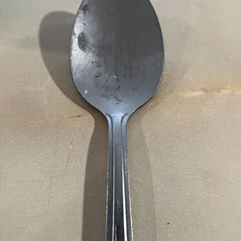 State Street Diner - Dirty spoon among the unclean table service placed on napkins and waiting at the table upon arrival. - Breakfast & Brunch Near Me - Geneva, Illinois