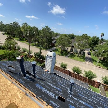 CM Roofing Pros - a man standing on the roof of a home - Roofing Near Me - Sugar Land, Texas CM Roofing Pros - a man standing on the roof of a home - Roofing Near Me - Sugar Land, Texas