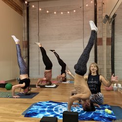 Hot House Yoga - Practicing headstands.
