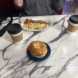 Cappuccino, bagel sandwich, breakfast rancheros Cappuccino, bagel sandwich, breakfast rancheros
