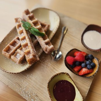 Madi - Churro waffle, spicy berry sauce, and the white sauce is sweet - Breakfast & Brunch Near Me - San Diego, California