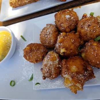 Joe's Farm Grill - The corn fritters with honey mustard. - American Near Me - Gilbert, Arizona Joe's Farm Grill - The corn fritters with honey mustard. - American Near Me - Gilbert, Arizona