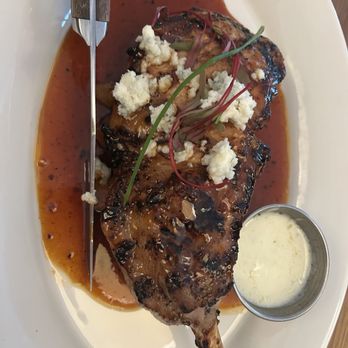 Oak House - Tomahawk Pork Chop; sweet potato medley, apple glaze, blue cheese - New American Near Me - Birmingham, Alabama Oak House - Tomahawk Pork Chop; sweet potato medley, apple glaze, blue cheese - New American Near Me - Birmingham, Alabama