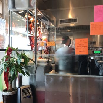 Pleasant BBQ Garden - a blurry photo of a restaurant kitchen - Barbeque Near Me - Duluth, Georgia
