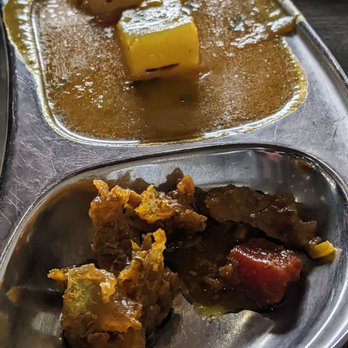 Ghareeb Nawaz - Closeup of the sides in the aloo paratha (potato and chutney) - Indian Near Me - Chicago, Illinois Ghareeb Nawaz - Closeup of the sides in the aloo paratha (potato and chutney) - Indian Near Me - Chicago, Illinois