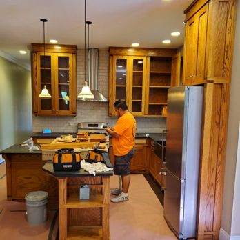 Axel Refinishing - A before of a kitchen we painted white - Refinishing Services Near Me