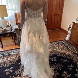 Theresa's Alterations - Uneven bustle, ball of fabric underneath and long fabric dragging behind