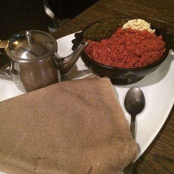 Beteseb Restaurant - The best kitfo! The container next to the kitfo is melted butter, gives the kitfo so much flavor! - Ethiopian Near Me - Silver Spring, Maryland